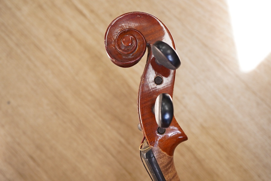 A cased students violin